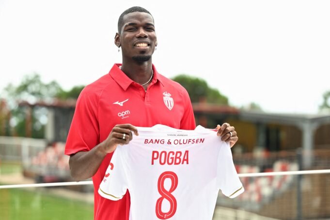 French-midfielder-Paul-Pogba-poses-with-his-new-jersey.jpeg